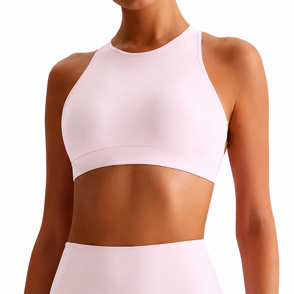 pink sports bra worn by a woman on a white background